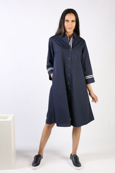 A classic shirt dress is hard to beat and this Harvey dress is one for the wardrobe staple. In a solid color, it features a top to bottom button through closure with a collar and full cuffed sleeves with a contrasting under cuff. In a midi length, this dr