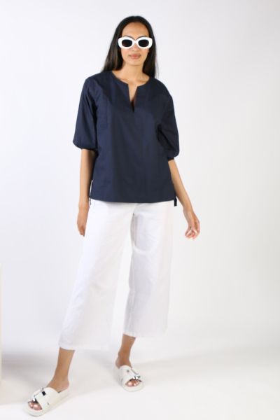 Go for easy vibes this season in this Elka top by Bagruu. In a round split neck and a panelled design, the top has peasant sleeves and can be styled with easy pants for a perfect day to night look. 