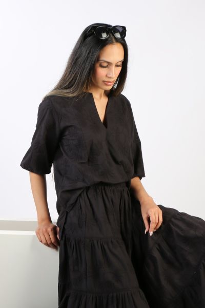 Go for easy vibes this season in this Elka top by Bagruu. In a round split neck and a panelled design, the top has peasant sleeves and can be styled with easy pants for a perfect day to night look. 