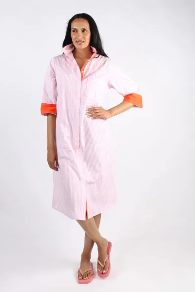 A classic shirt dress is hard to beat and this Harvey dress is one for the wardrobe staple. In a fun stripe color, it features a top to bottom button through closure with a collar and full cuffed sleeves with a black color under cuff. In a midi length, th